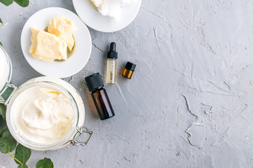 diy body butter with ingrdients on concrete background