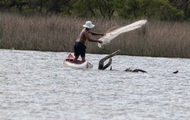 A fisherman on a boat