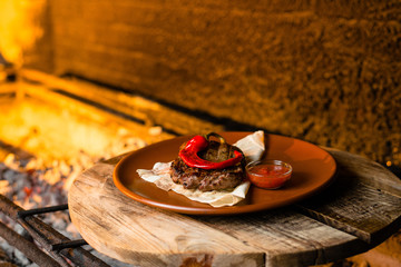 grilled meat with spicy red pepper on pita bread