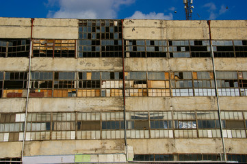 old factory building. old factory wall with broken windows