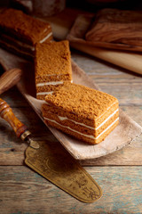Homemade layered honey cake with cream.