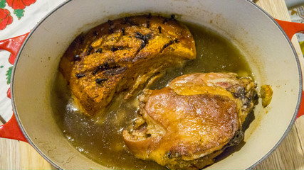 Pork and rabbit meat stewing in a pot