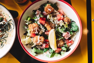 Fried shrimp salad with lemon and watermelon