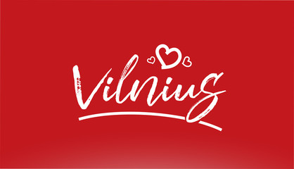 vilnius white city hand written text with heart logo on red background