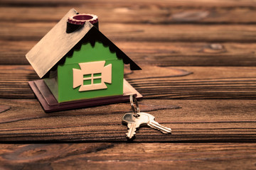 Obraz na płótnie Canvas house, house keys on wooden background. real estate, insurance. business, Finance.