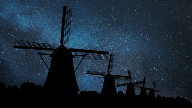 Netherlands rural lanscape with characteristic dutch windmills by Night with Stars, in famous tourist site Kinderdijk, UNESCO world heritage site, Alblasserdam, Rotterdam, Holland