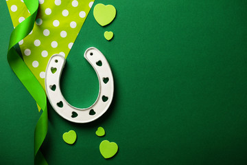 St Patrick's Day green background with lucky horseshoe - Powered by Adobe