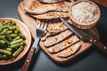 grilled chicken breast with cooked rice and vegetables, healthy food