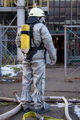 Firefighters in chemical protection suit.