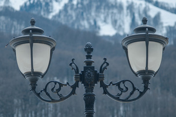 Fototapeta na wymiar Street lamps on the background of mountains