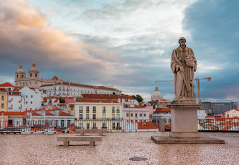 Fototapeta na wymiar Portugal, Lisbon, Alfama, Largo Portas do Sol at Dawn, Statue of St. Vincent the patron saint of Lisbon