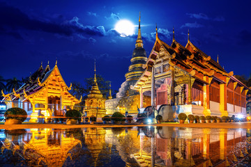 Wat Phra Singh temple at night in Chiang Mai, Thailand. - obrazy, fototapety, plakaty