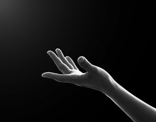 Fototapeta premium Prayer's hand praying for spiritual support, help and humanitarian aid concept ( woman’s hand isolated on balck background with clipping path)