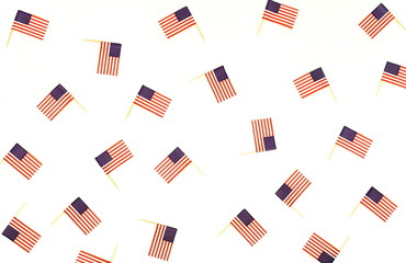 4th of July American Independence Day USA flags decorations on white  background. Flat lay, top view, copy space.  day