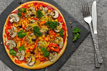 Vegan pizza with mushrooms, vegetables and herbs. Keto diet. Pegan diet.