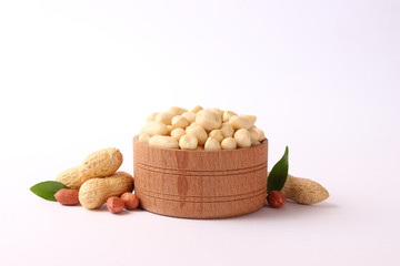  peeled peanuts in a bowl isolated on white