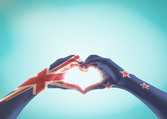 New Zealand flag pattern on people hands in heart shape for NZ national public holiday celebration