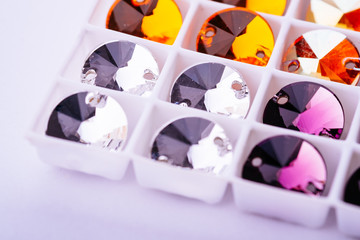 Swarovski crystal jewelry many material bright colors close up for handmade on white background