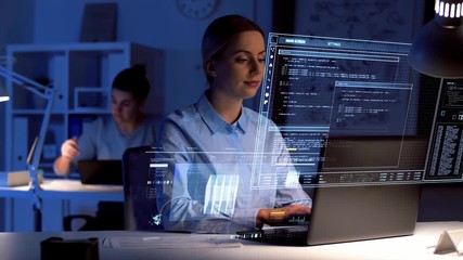 business, deadline and technology concept - businesswoman with laptop computer and virtual screen projection working at dark night office - Powered by Adobe