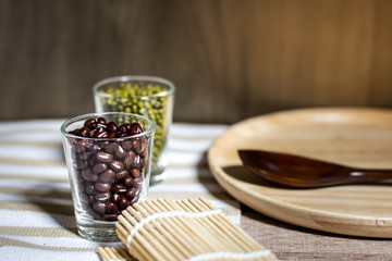 Cereals in glass cups placed on a wooden background