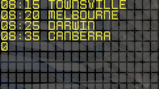 Close-up of an airport departure board to Australian cities destinations, with environment reflection. Part of a series. 4k video resolution (4096x2304).