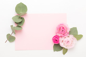 Beautiful colored ranunculus flowers on a white background. Spring greeting card.