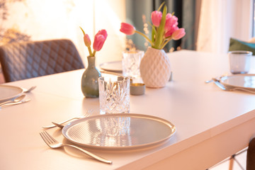 Decorated Table with Tulips, Plates and Glasses
