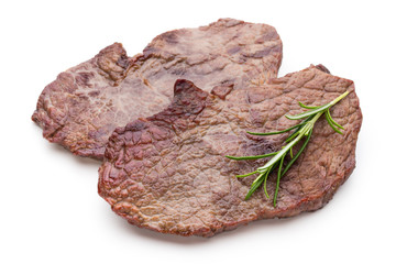 Grilled beef steaks with spices isolated on white background.