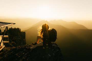 silhouette of photographer at sunset in mountains