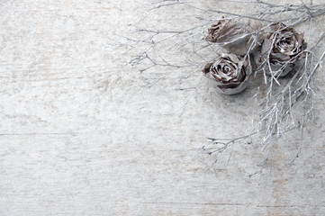 Surreal floral background, decorated rose. Conceptual floral design.Copy space.On a wooden surface.