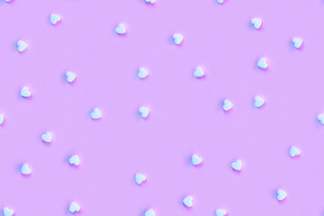 Seamless pattern. Violet repeating background with hearts in trendy colors.