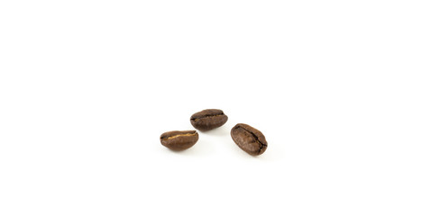 Three coffee beans on white background