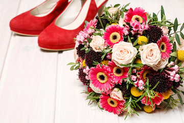 Wedding bouquet and a pair of stilettos.