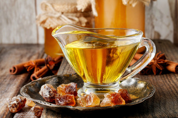 Glass gravy boat with honey.