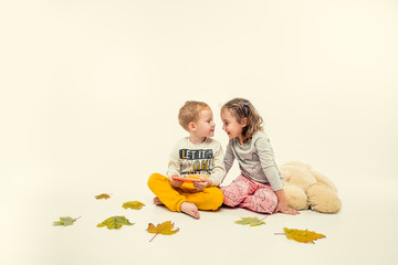 children in winter pajamas hugging each other