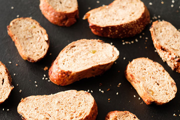 Healthy home made nutrition. Wholegrain bread bakery. Slices pattern background