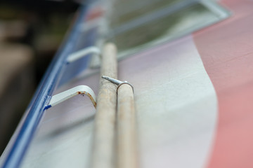 abstract close up of boat hook and pole on top of canal barge