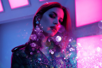 Beautiful girl in retro wave on the neon light. Portrait with double exposure effect