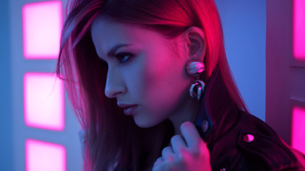 Futuristic style portrait in blue and purple light.