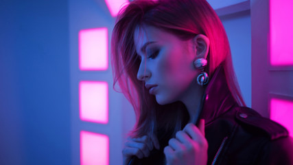 Futuristic style portrait in blue and purple light.