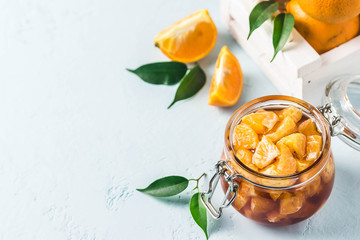 Citrus, ginger jam in a jar. Selective focus, space for text.