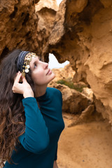 Model portrait with sand stone canyon rocks in the background