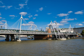 Hungerford Bridge. Crosses the River Thames in London, and lies between Waterloo Bridge and...
