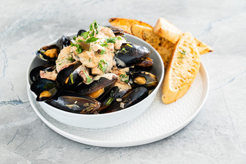 Mussels with herbs in a bowl
