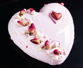 Cake with strawbery in the shape of heart on Valentine's Day
