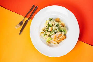 fresh caesar salad on the bright background