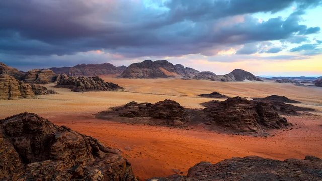 Time lapse Movie Sunset Scene of Wadi rum Desert in Jordan, It is also known as the Valley of the Moon, Many Movie Shot in Wadi Rum