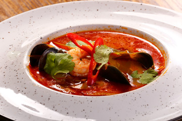 Thoam iam soup on  black wood background 