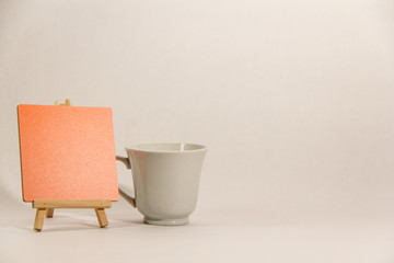 Board and cup on white background for home decor