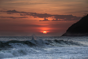 beautiful sunset on the beach of itacoatiara in niterói, rio de janeiro, brazil